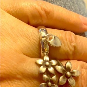 Silver ring with heart hanging